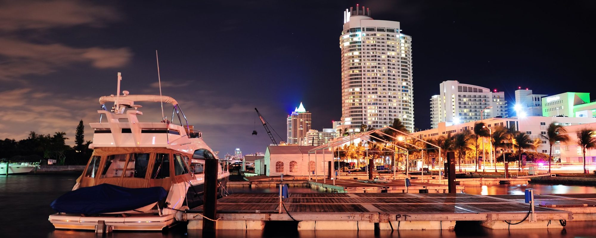 Miami south beach street view with water reflections at night